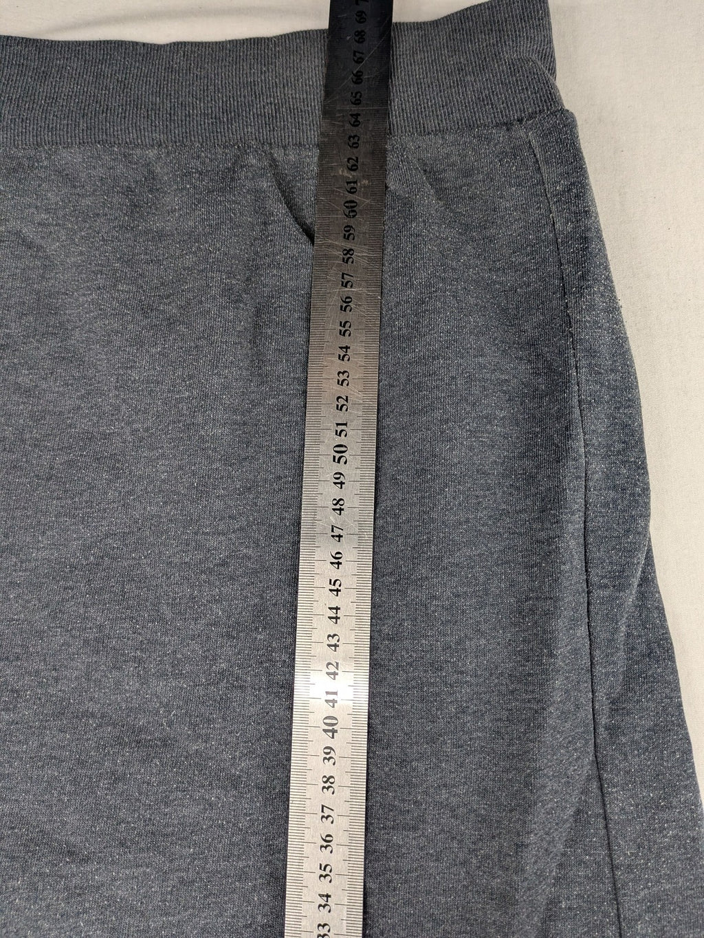 C&A grey hoodie with embossed chest logo, teddy-lined hood, and side zip pockets.