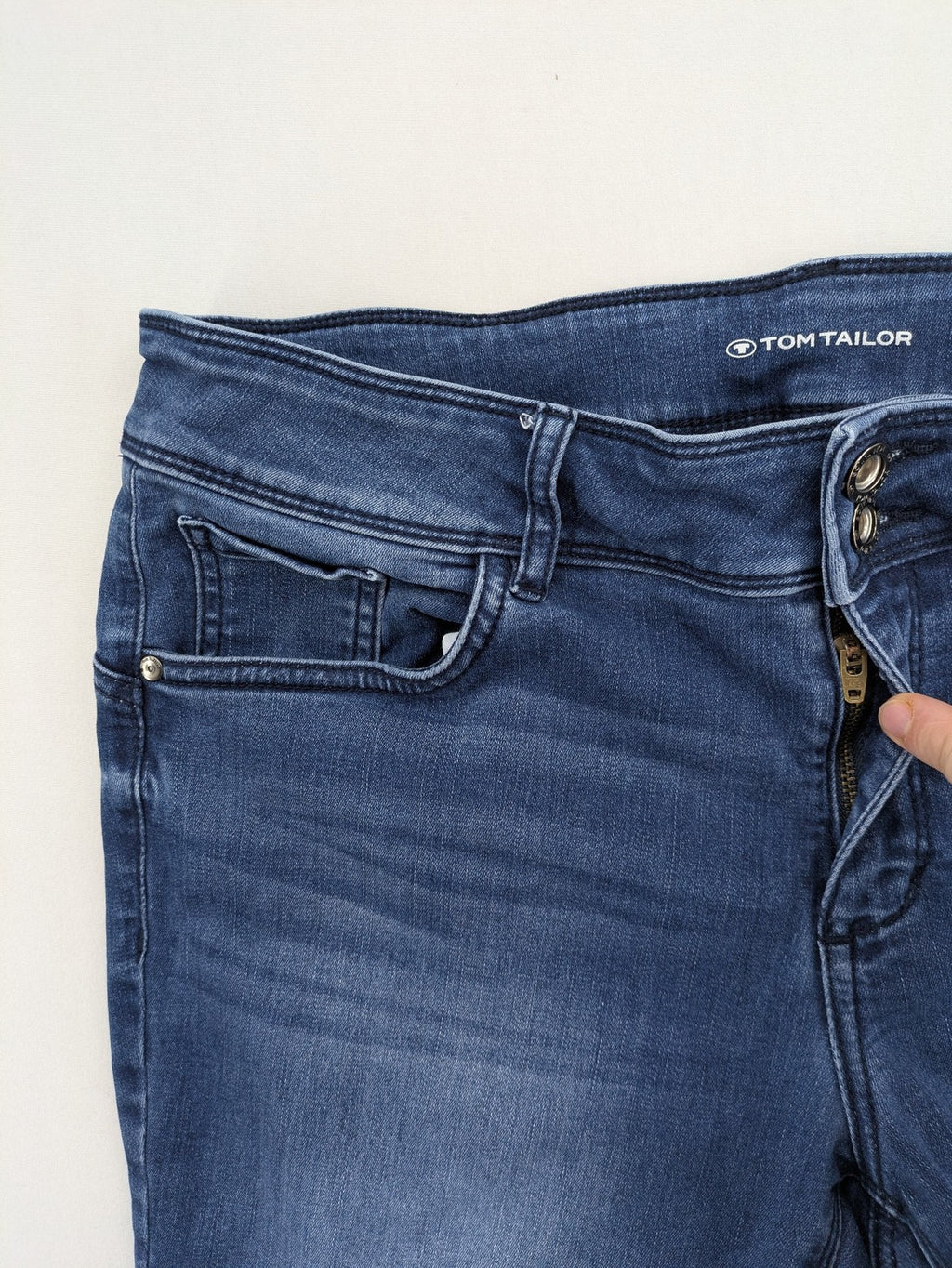 Tom Tailor blue skinny jeans with classic 5-pocket design and double button closure.