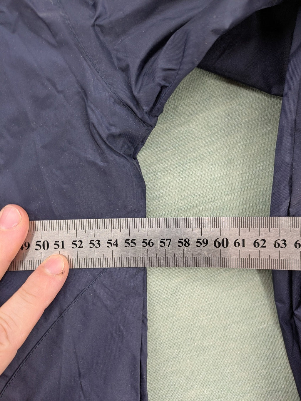 Jako navy windbreaker full zip jacket with breathable mesh lining and logo details.