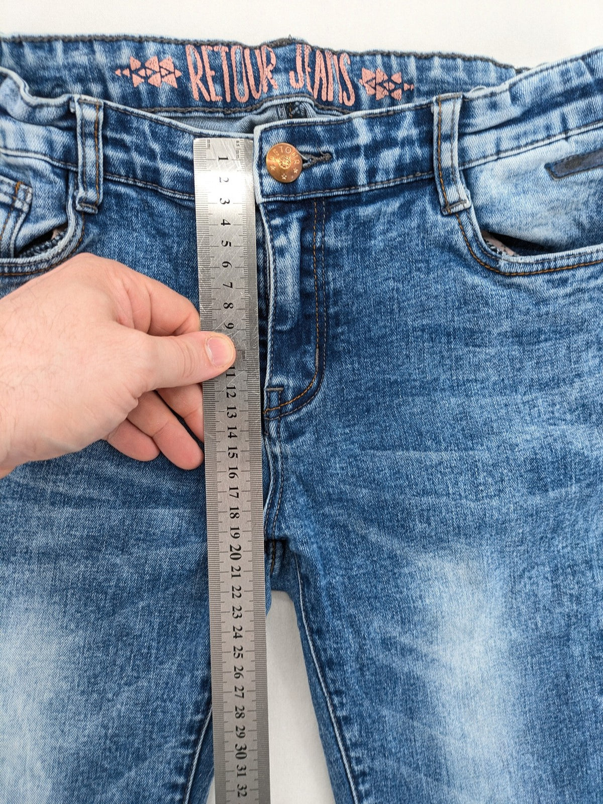 Retour blue slim fit jeans with classic 5-pocket style and adjustable waistband.