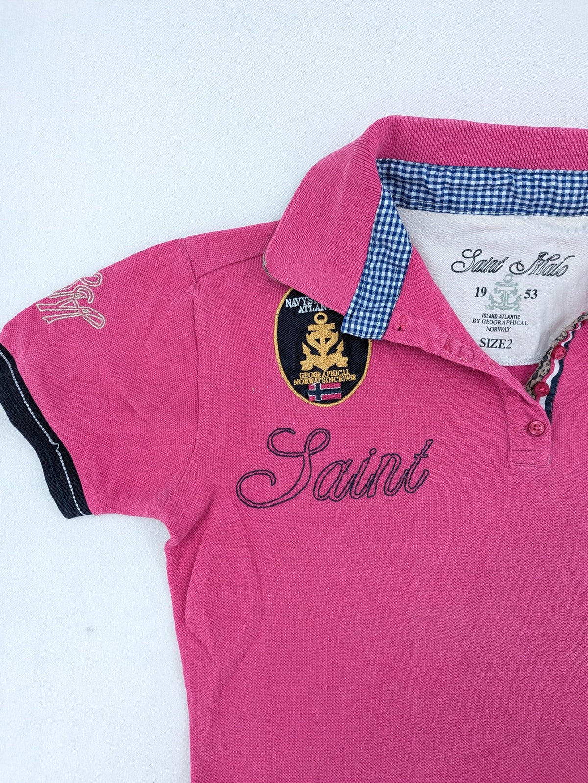 Geographical Norway pink polo shirt with embroidered Saint Malo design and Gingham trim.