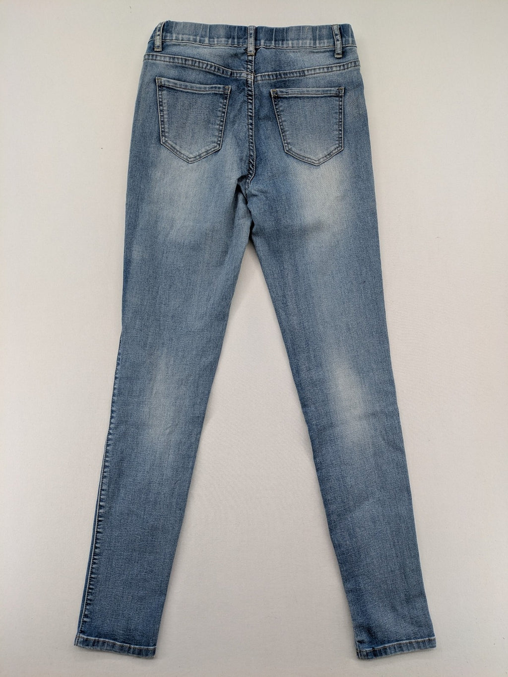 Miss Bonbon blue skinny jeans jeggings with elastic pull-on waistband and light wash.