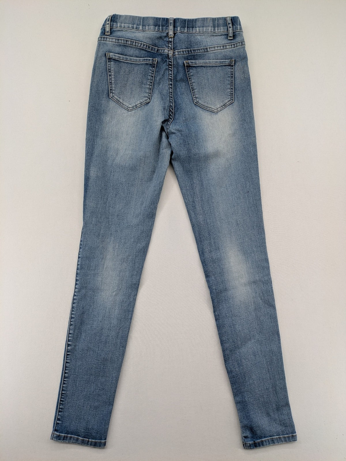Miss Bonbon blue skinny jeans jeggings with elastic pull-on waistband and light wash.