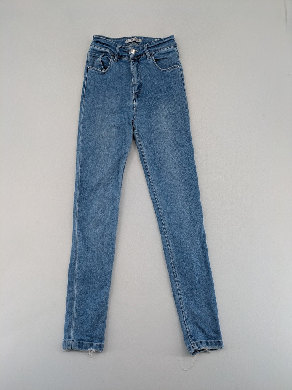 Metropoll blue high waist skinny jeans with frayed hem and classic 5-pocket design.