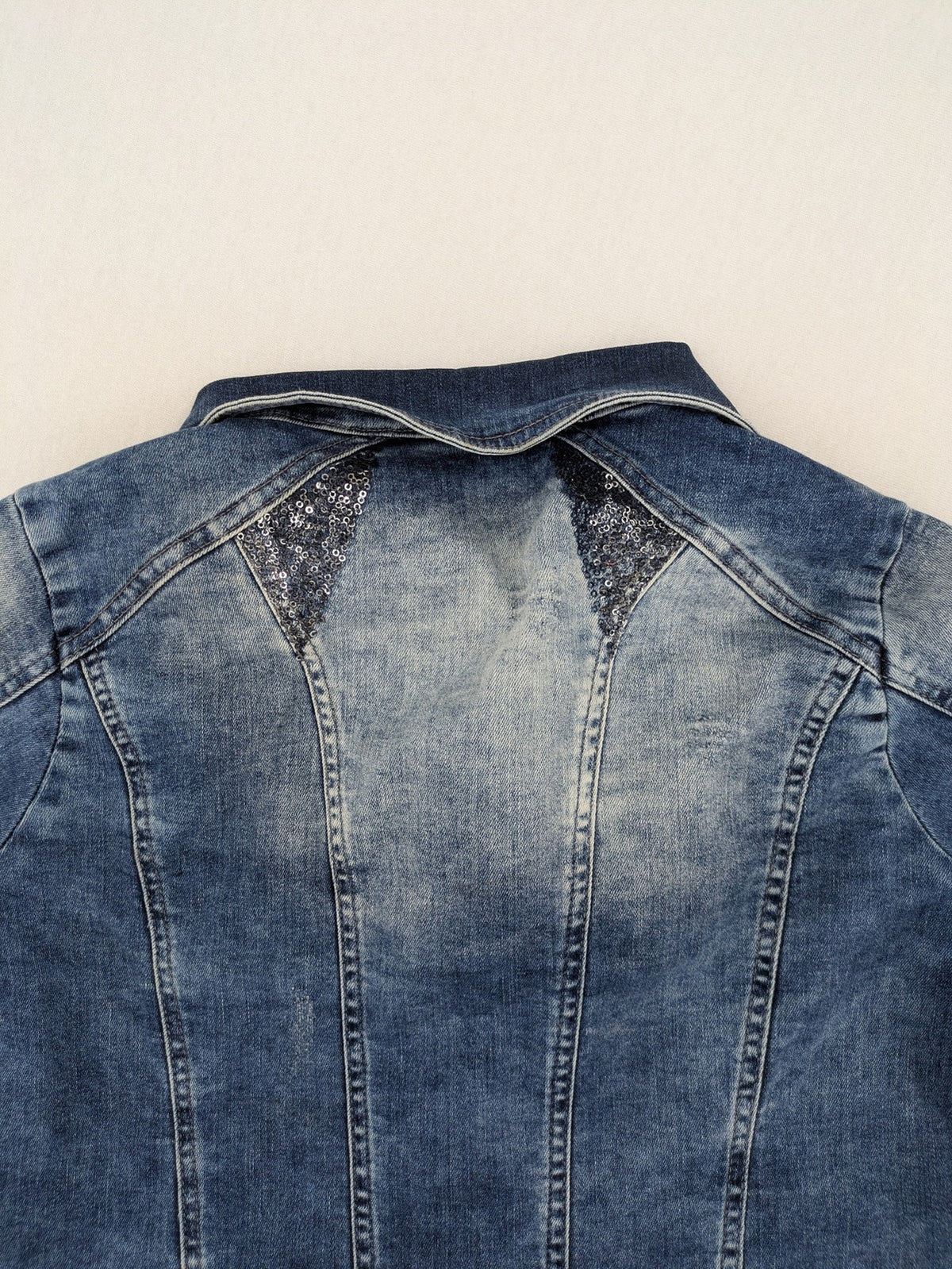 TREDY blue denim jacket with sequins, lace trim, and fitted design.