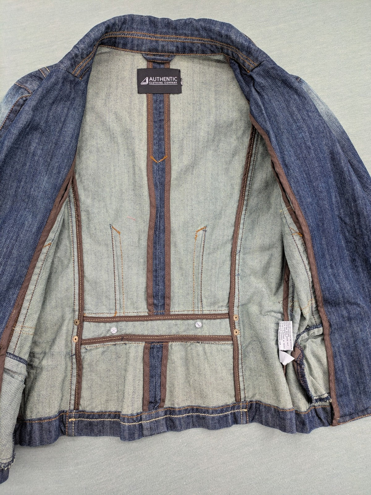 Authentic Clothing Company blue jeans blazer with contrast stitching and button closure.