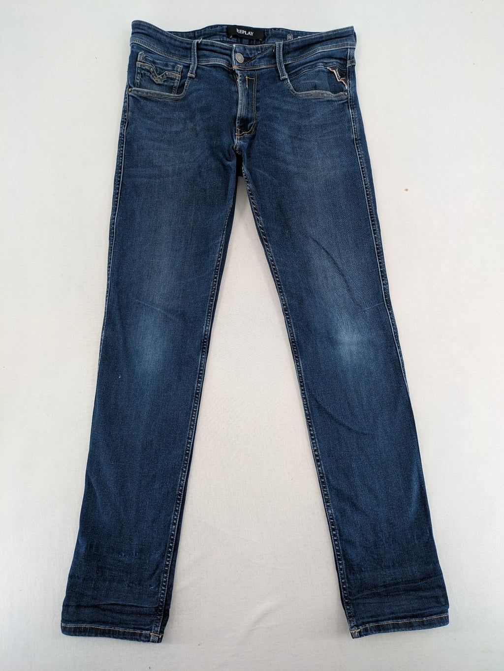 Replay slim fit jeans blue with subtle fading and stretch denim material.