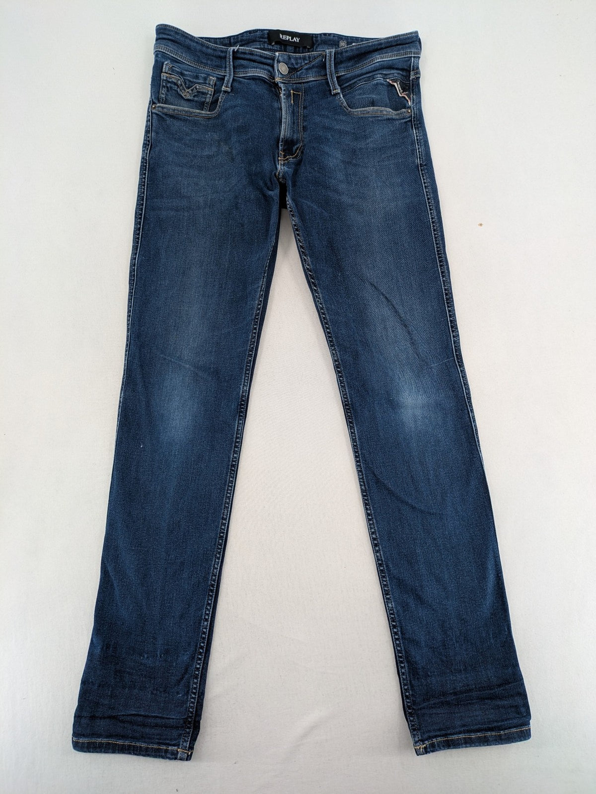 Replay slim fit jeans blue with subtle fading and stretch denim material.