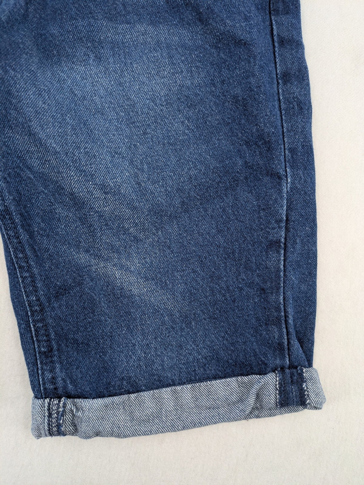 Pocopiano blue denim shorts with rolled cuffs and elastic waistband for comfort.