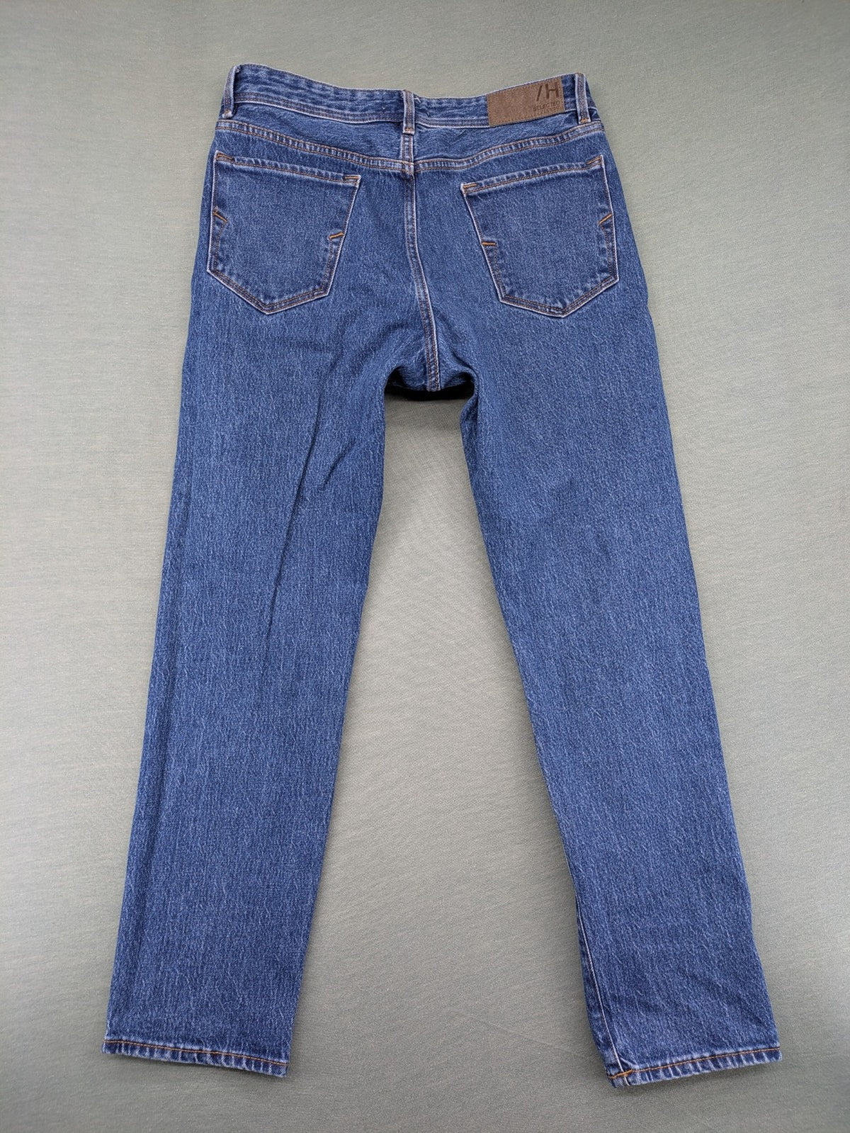 Selected Homme blue straight fit jeans with classic five-pocket design and medium wash denim.