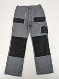 Watsons grey and black hunting tactical pants with Cordura reinforcements and elastic waistband.