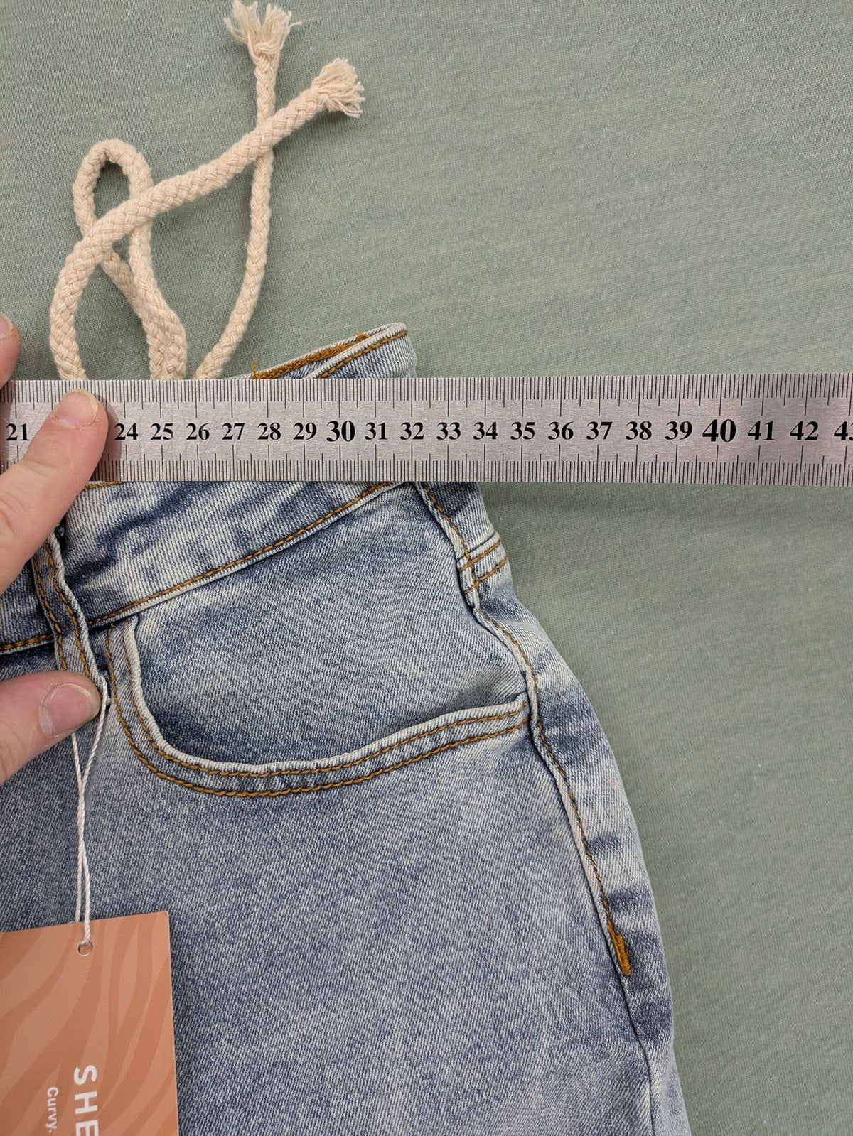 SHEIN blue straight jeans high waist with unique lacing details and stylish design.