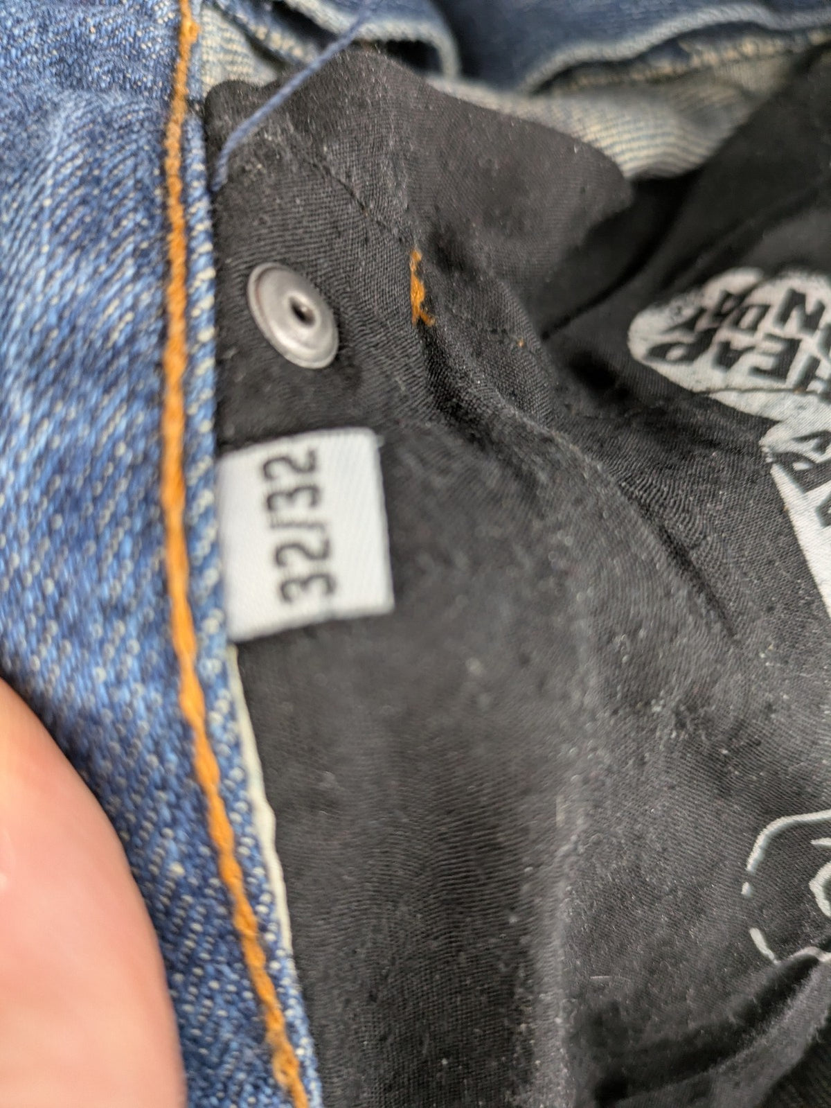 Cheap Monday blue straight jeans with button fly and classic medium wash finish.