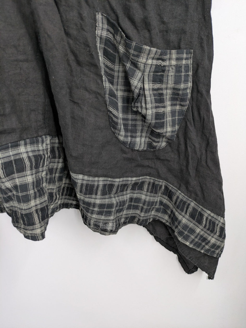 Lagenlook black linen bridal party dress asymmetrical cut with checkered hem and diagonal zipper.