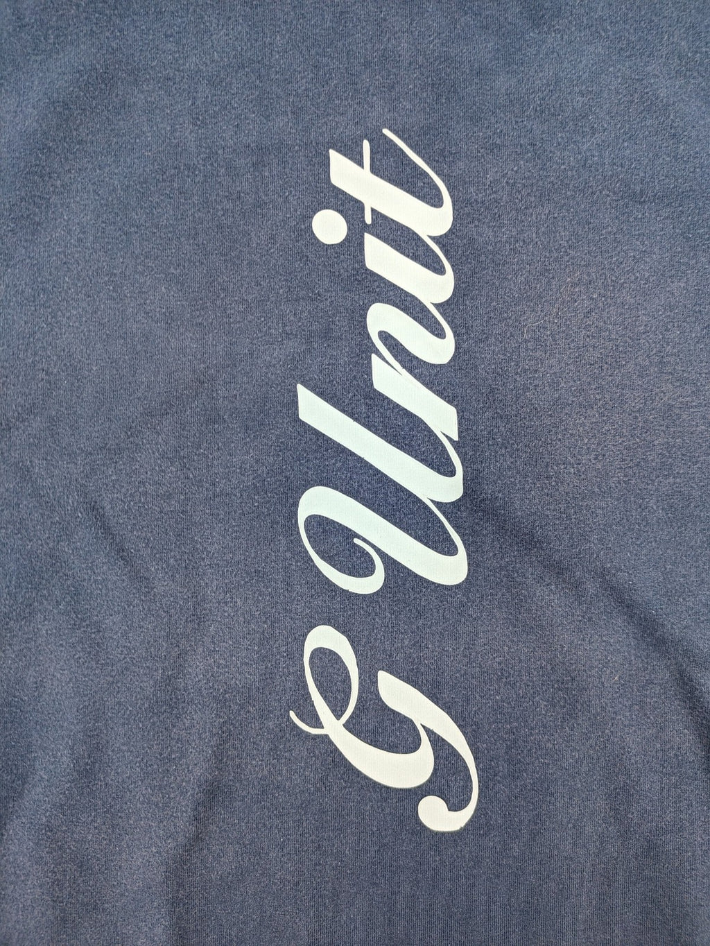 G-Unit navy vintage T-shirt with vertical logo print and V-neck design.