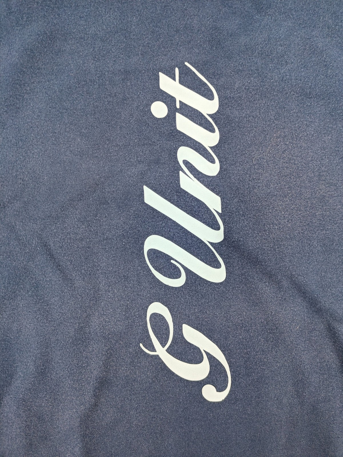 G-Unit navy vintage T-shirt with vertical logo print and V-neck design.