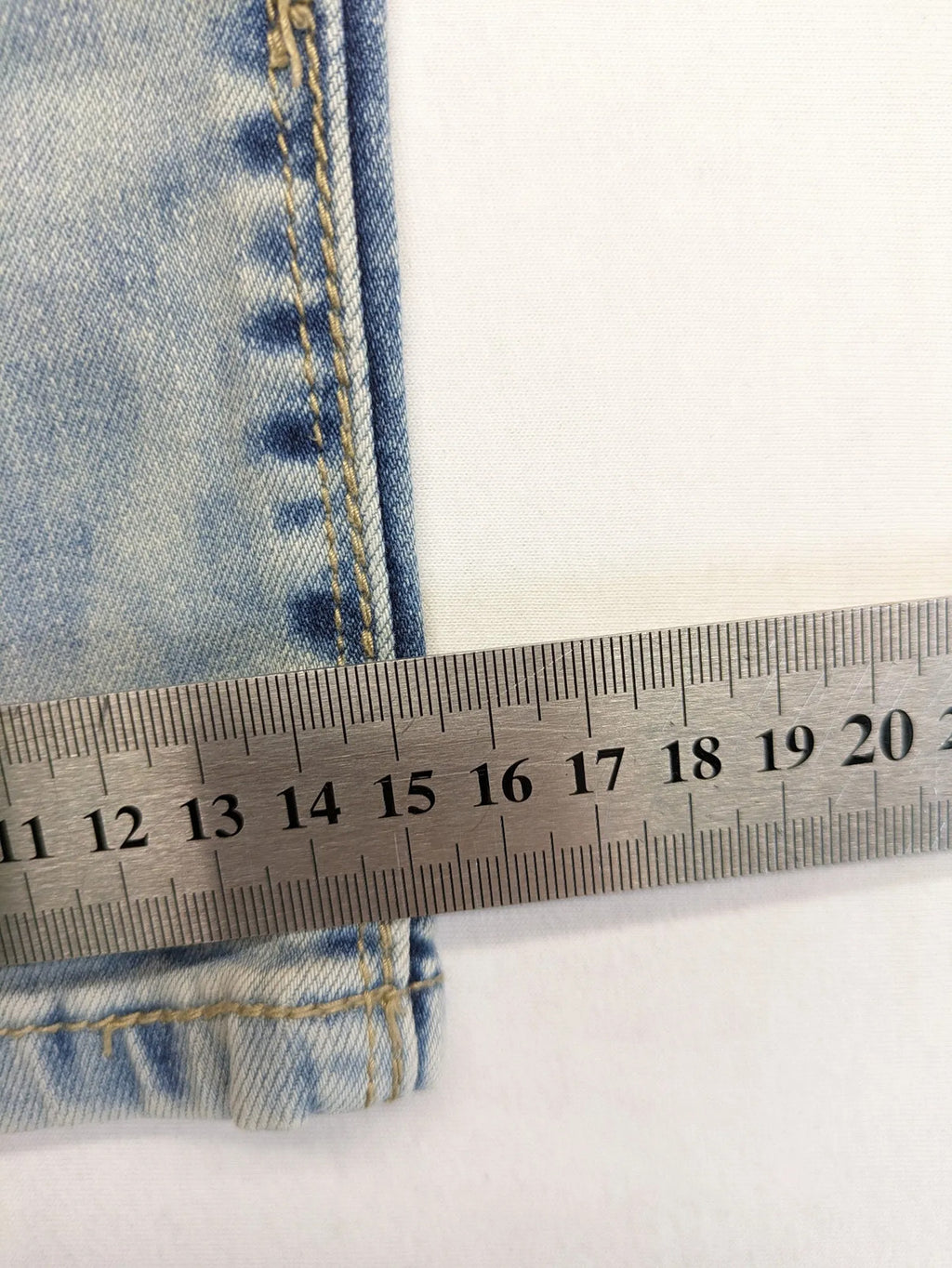 ONE LOVE DENIM blue straight jeans with distressed details and double button closure.