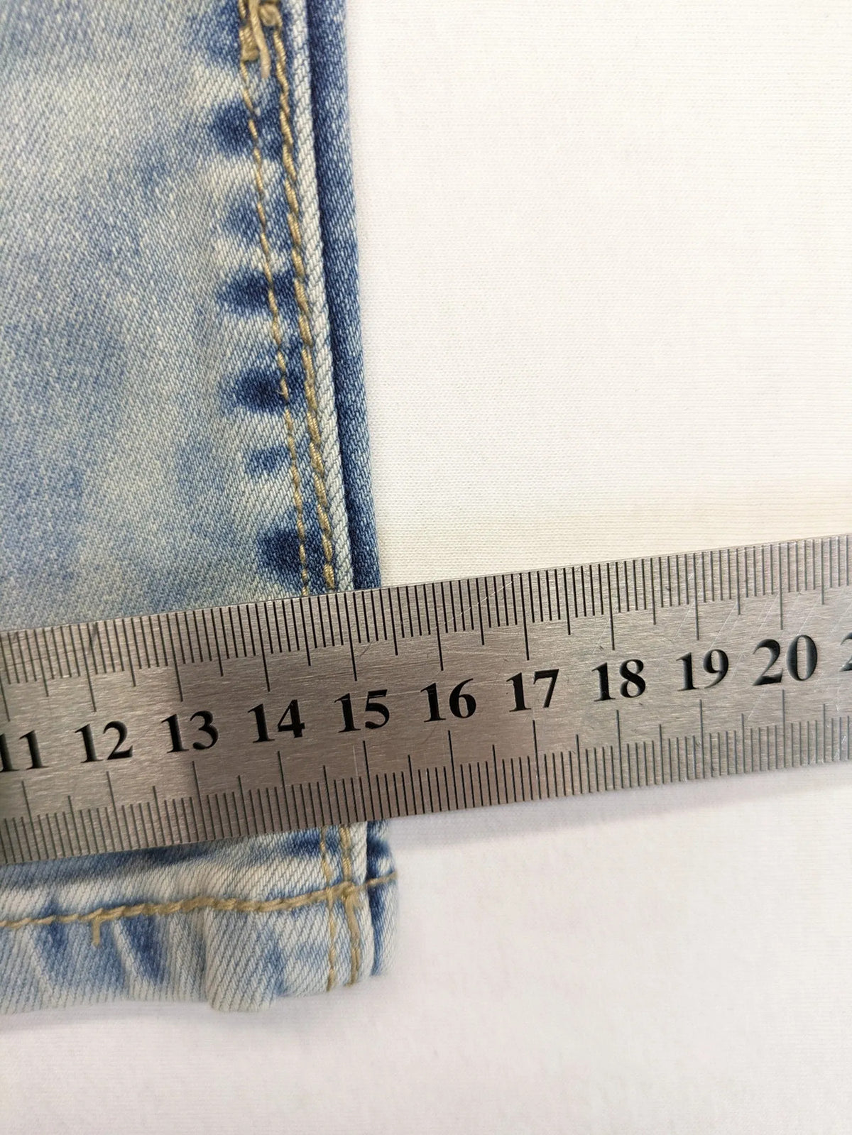 ONE LOVE DENIM blue straight jeans with distressed details and double button closure.
