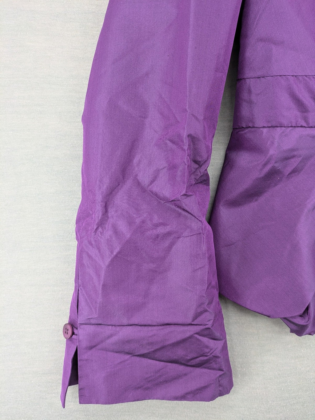 Claudia Sträter purple silk blazer with shawl collar and belt detail.