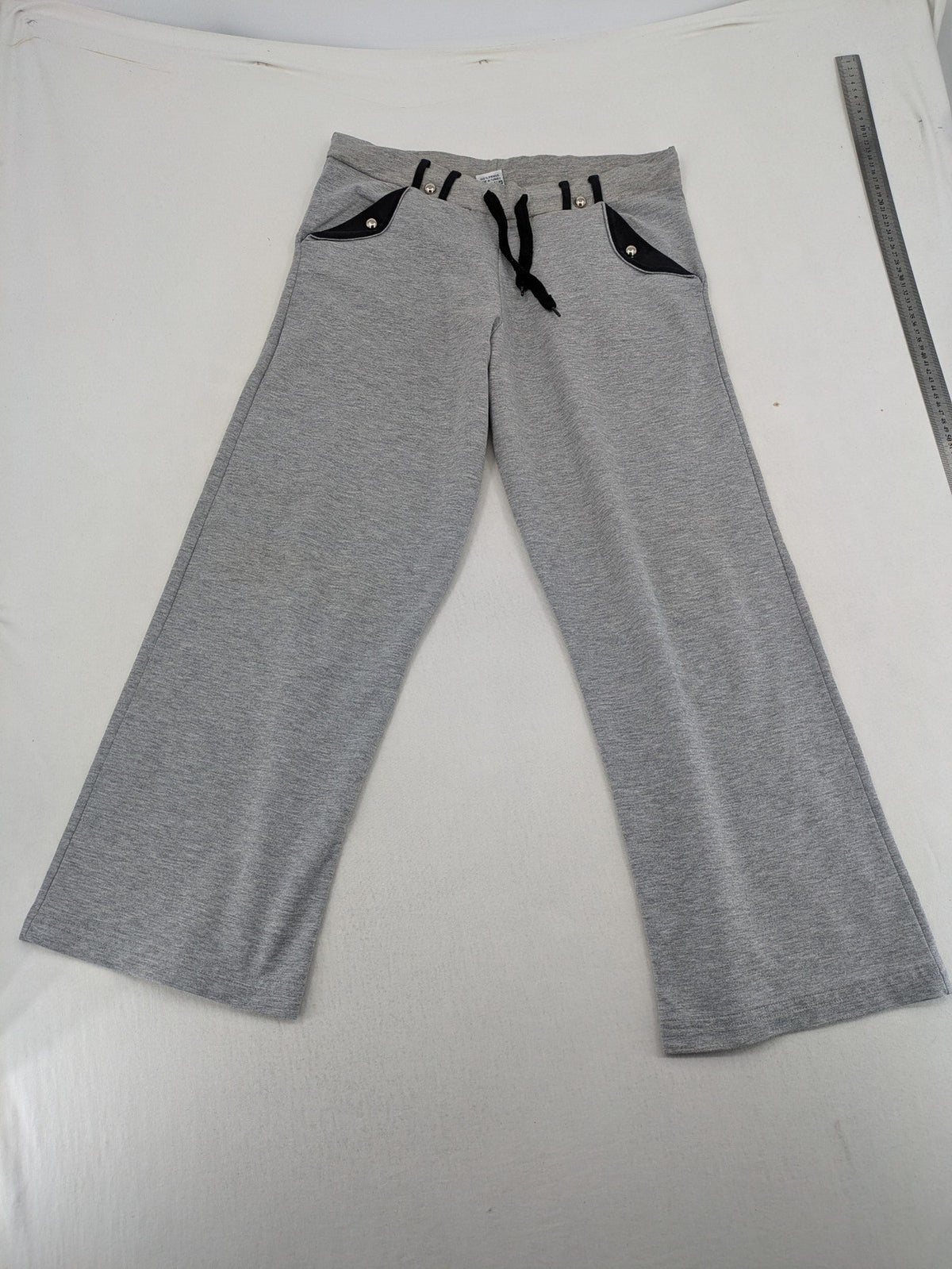 Falconhill grey jogging pants with elastic waistband, drawstring, and stylish black accent pockets.