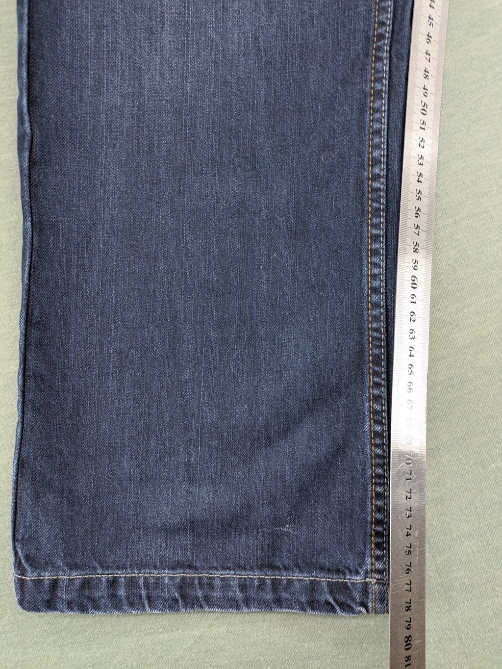 Canda blue straight jeans with five-pocket design and dark wash denim.
