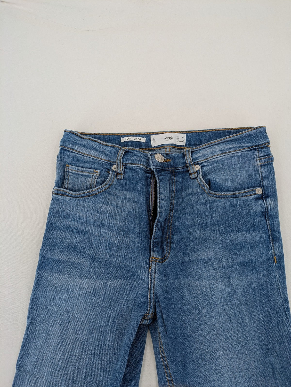 MNG blue straight jeans with kick-flare leg and raw hem, made of cotton blend.