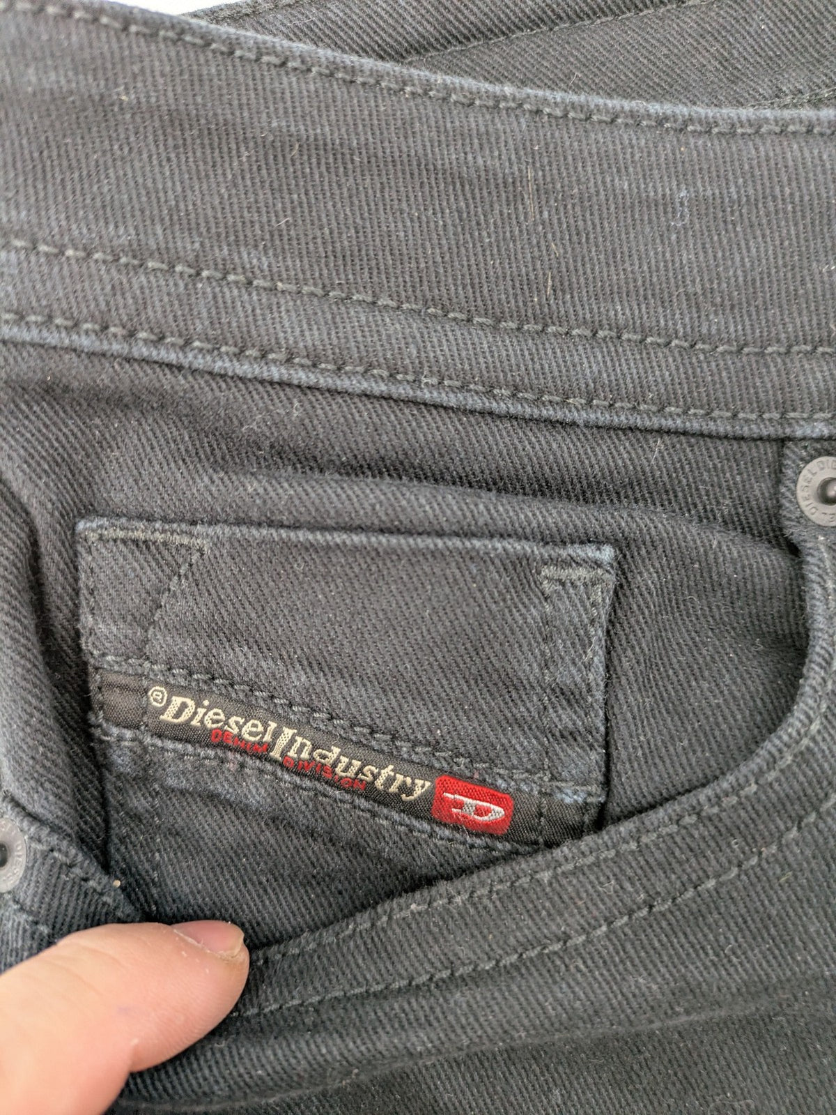 Diesel black Thommer Slim jeans with classic 5-pocket design and stretch material.