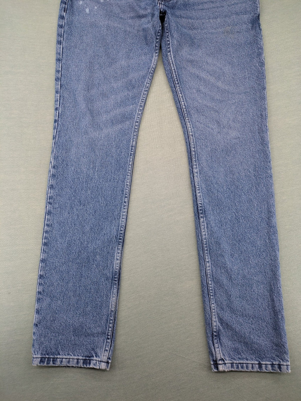 Wrangler blue straight jeans with button fly and classic 5-pocket design.