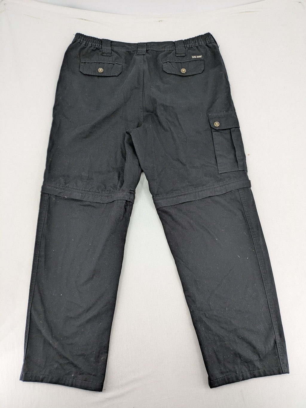 Travel Master black hunting and tactical pants, zip-off design, 100% cotton, multiple pockets.