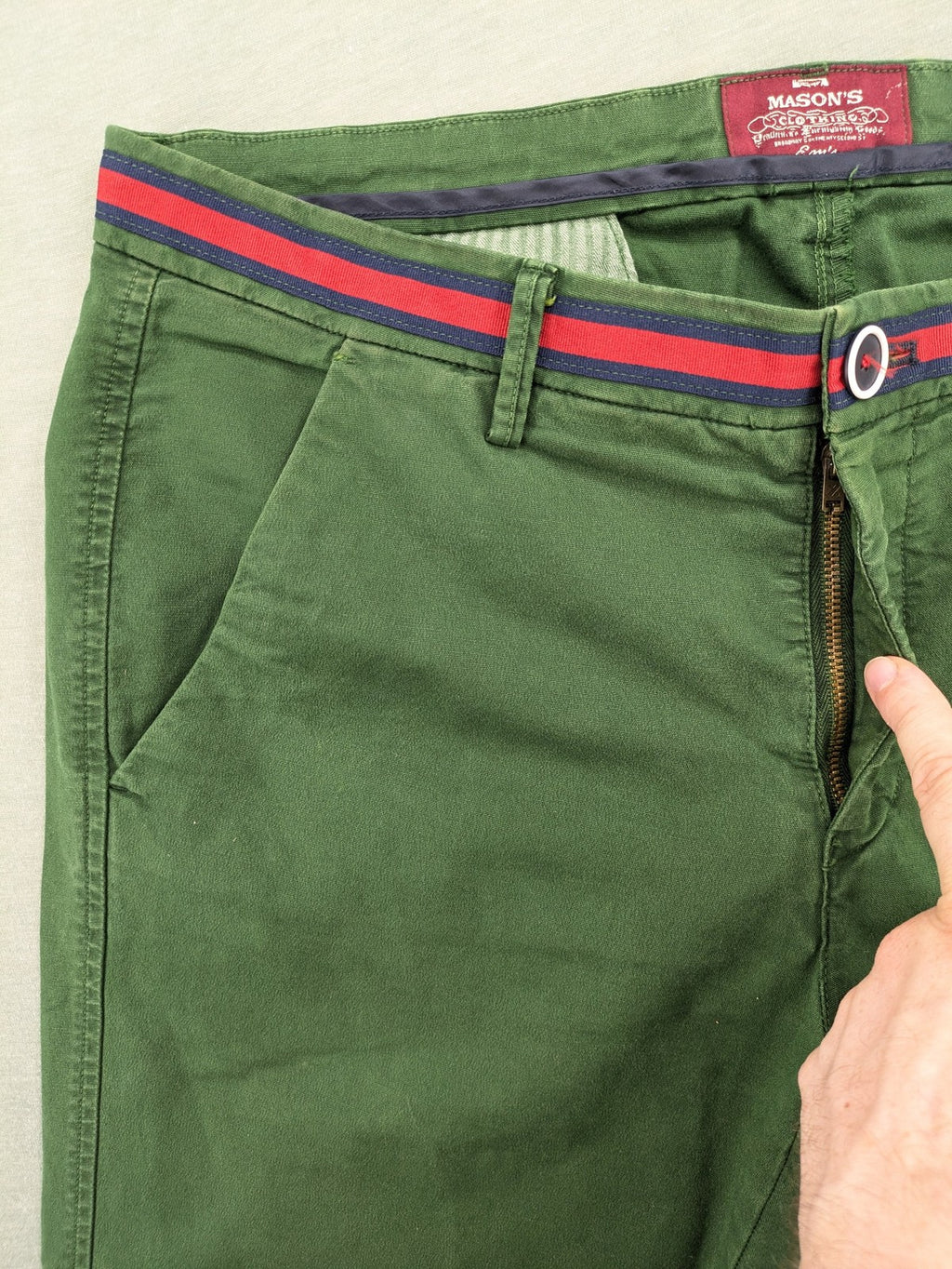 Mason's green chino pants with striped red and blue waistband, cotton stretch material.