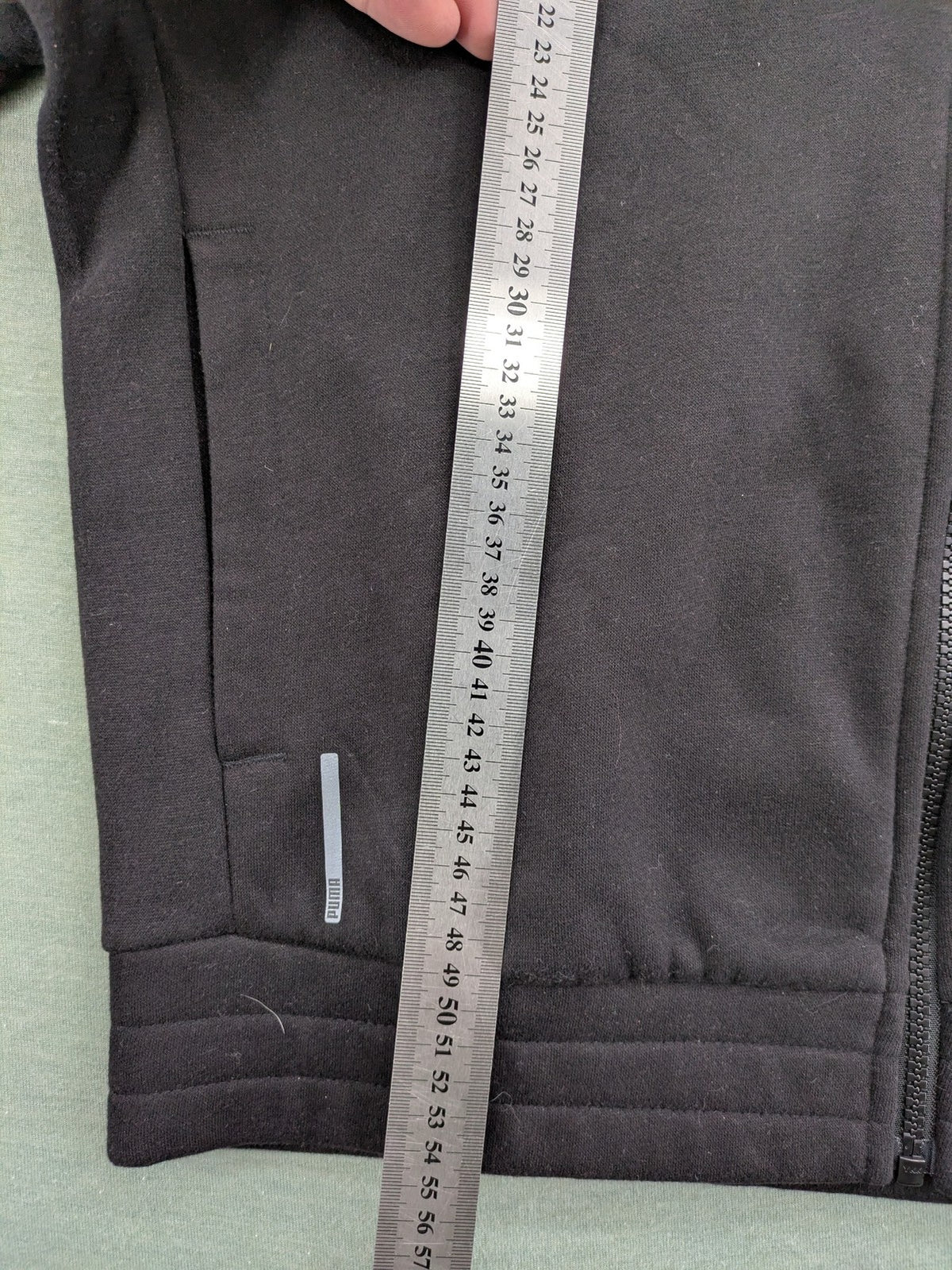 Puma grey zip-through hoodie with iconic logo and two practical pockets.