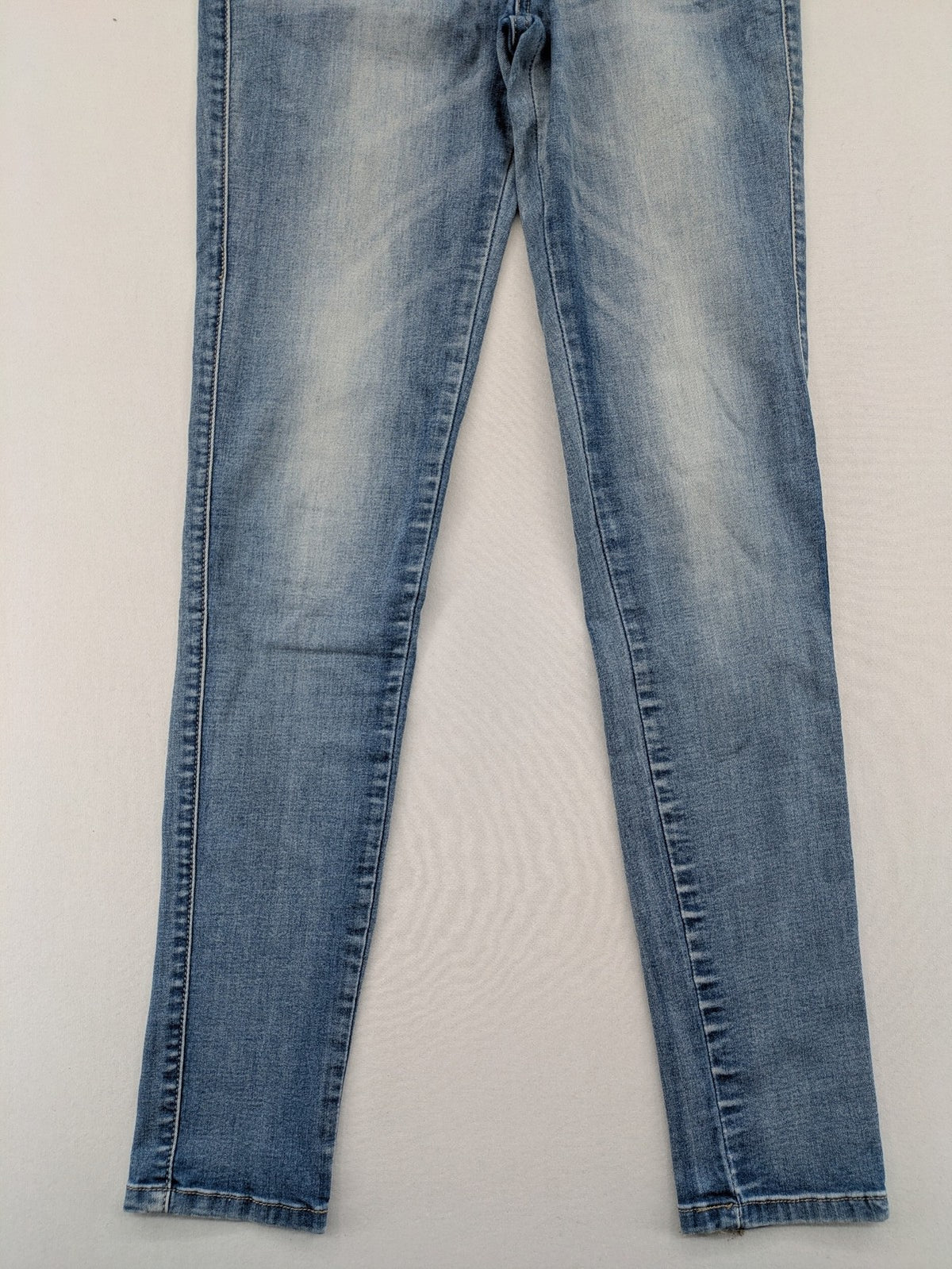 Miss Bonbon blue skinny jeans jeggings with elastic pull-on waistband and light wash.
