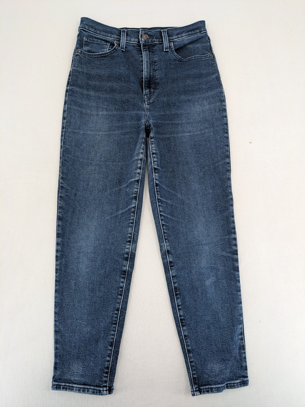Levi's high waisted taper jeans dark blue 5-pocket design with zipper and stretch material.