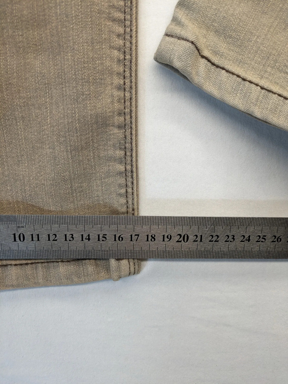 Masha khaki straight jeans with rhinestone embellishments and decorative stitching.