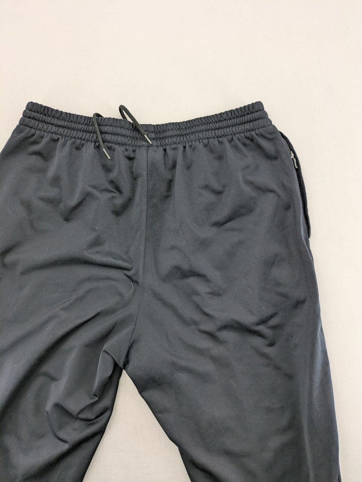 Jako black jogging pants with elastic waistband and ribbed ankle cuffs.