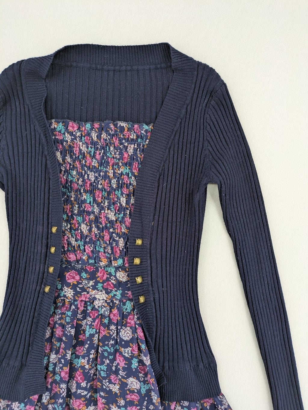 Damen turtle neck jumper dark blue floral ribbed knit with delicate lace hem.