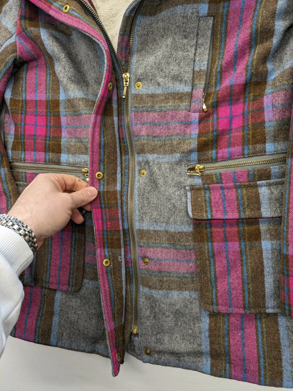 Johnnie B pink coat with gray check pattern, Sherpa lining, and zip closure.