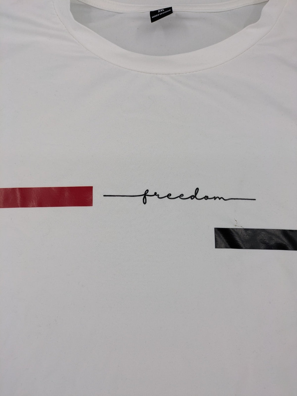 Manfinity black and white outfit set with red accents and "Freedom" graphic print.