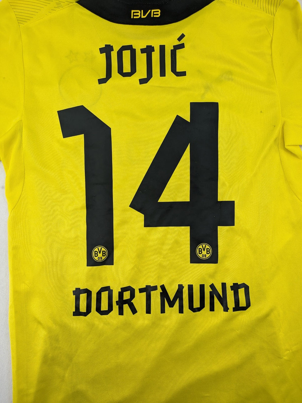 Borussia Dortmund black and yellow soccer uniform with DFB Pokal 2014 patch and Puma logo.