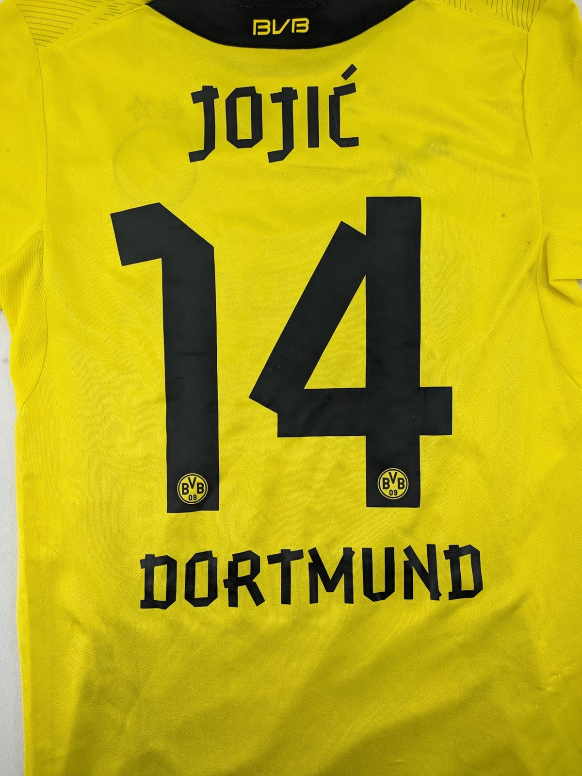 Borussia Dortmund black and yellow soccer uniform with DFB Pokal 2014 patch and Puma logo.