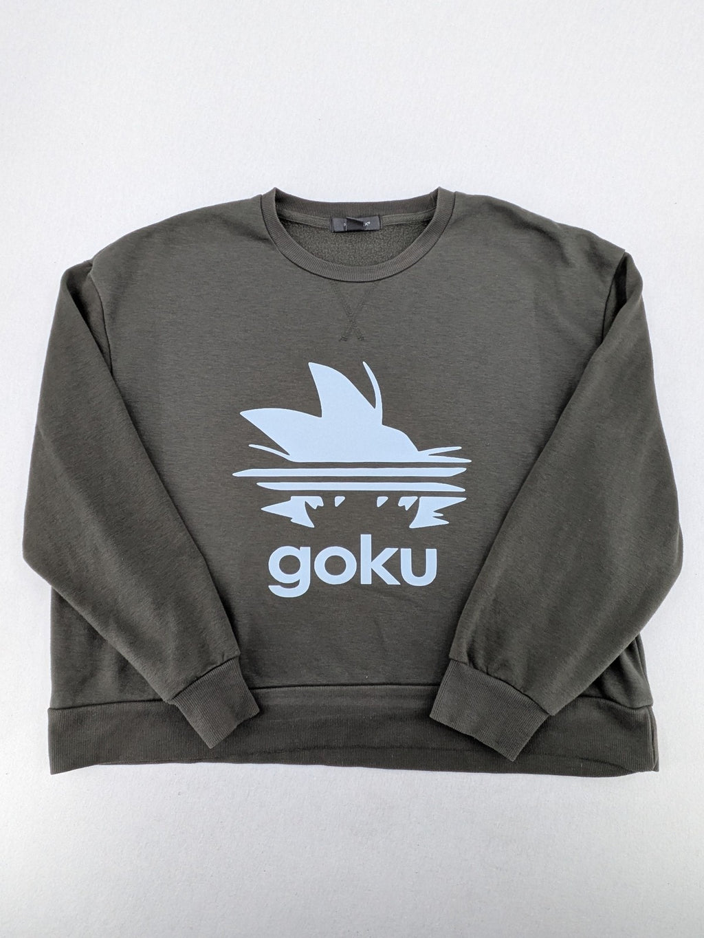 Dragon Ball Z blue sweatshirt featuring Son-Goku graphic and Primark logo.
