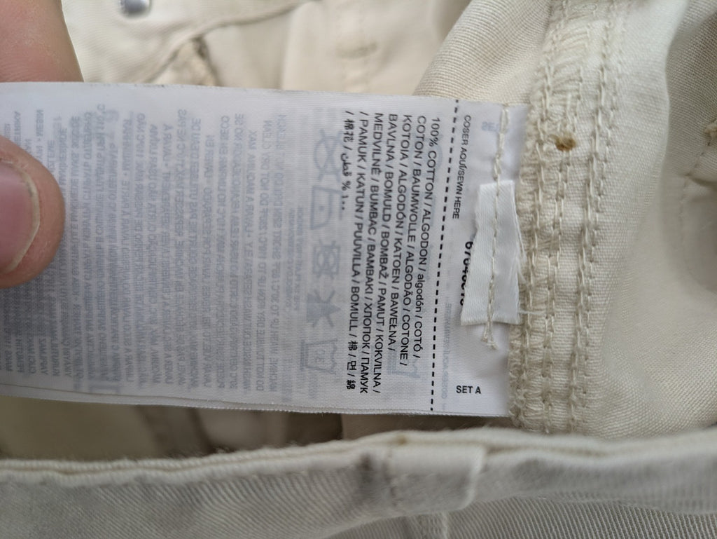 MNG beige cargo pants with straight leg, button closure, and patch pockets.