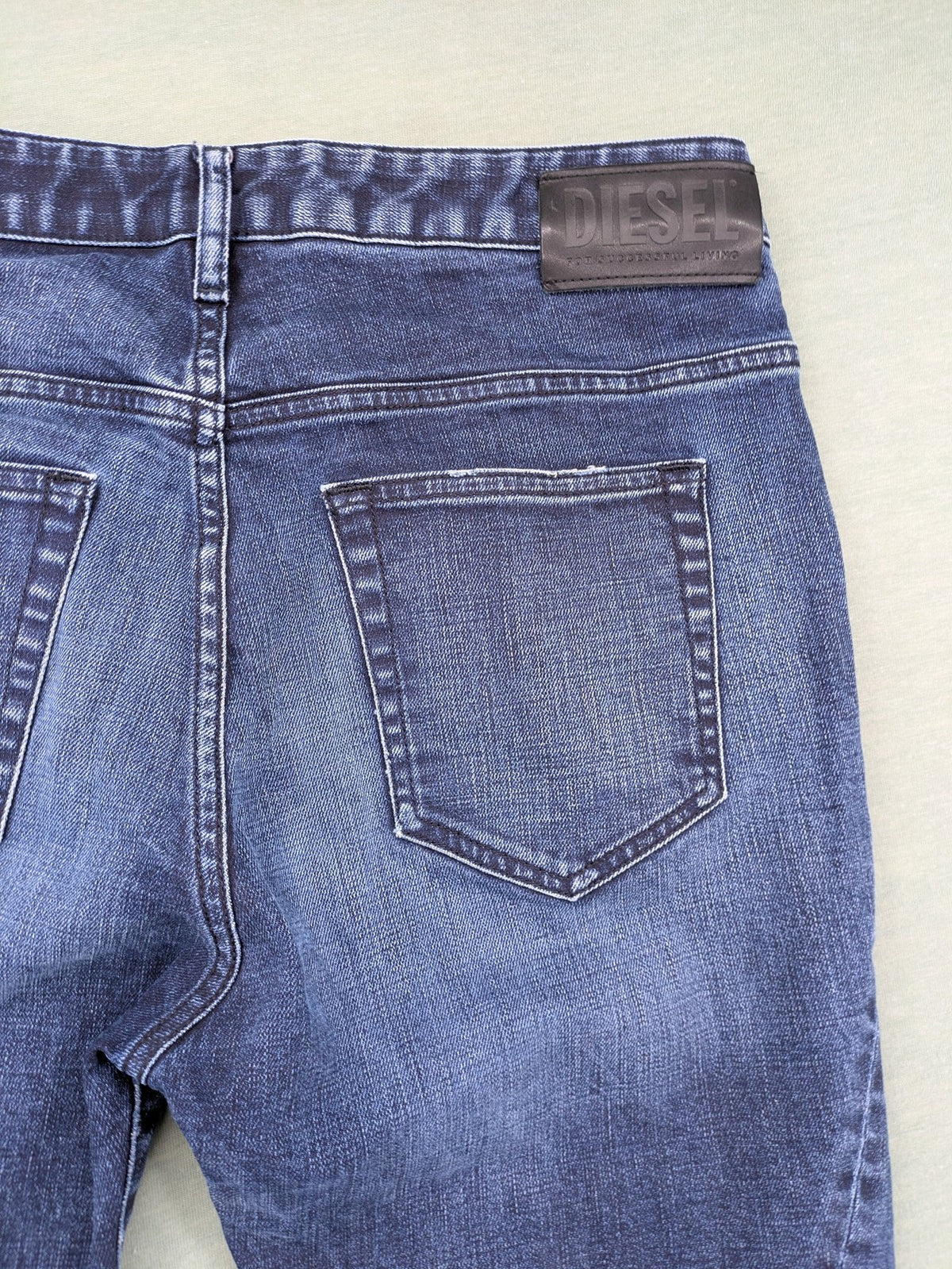 Diesel blue boyfriend jeans low waist dark wash stretch denim with logo patch.