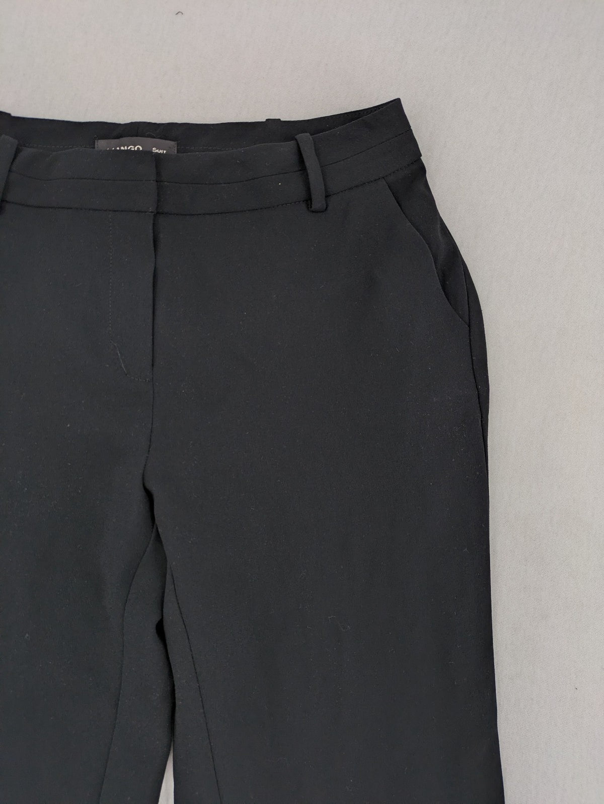Mango Suit black trousers with zipper, belt loops, and front slant pockets.