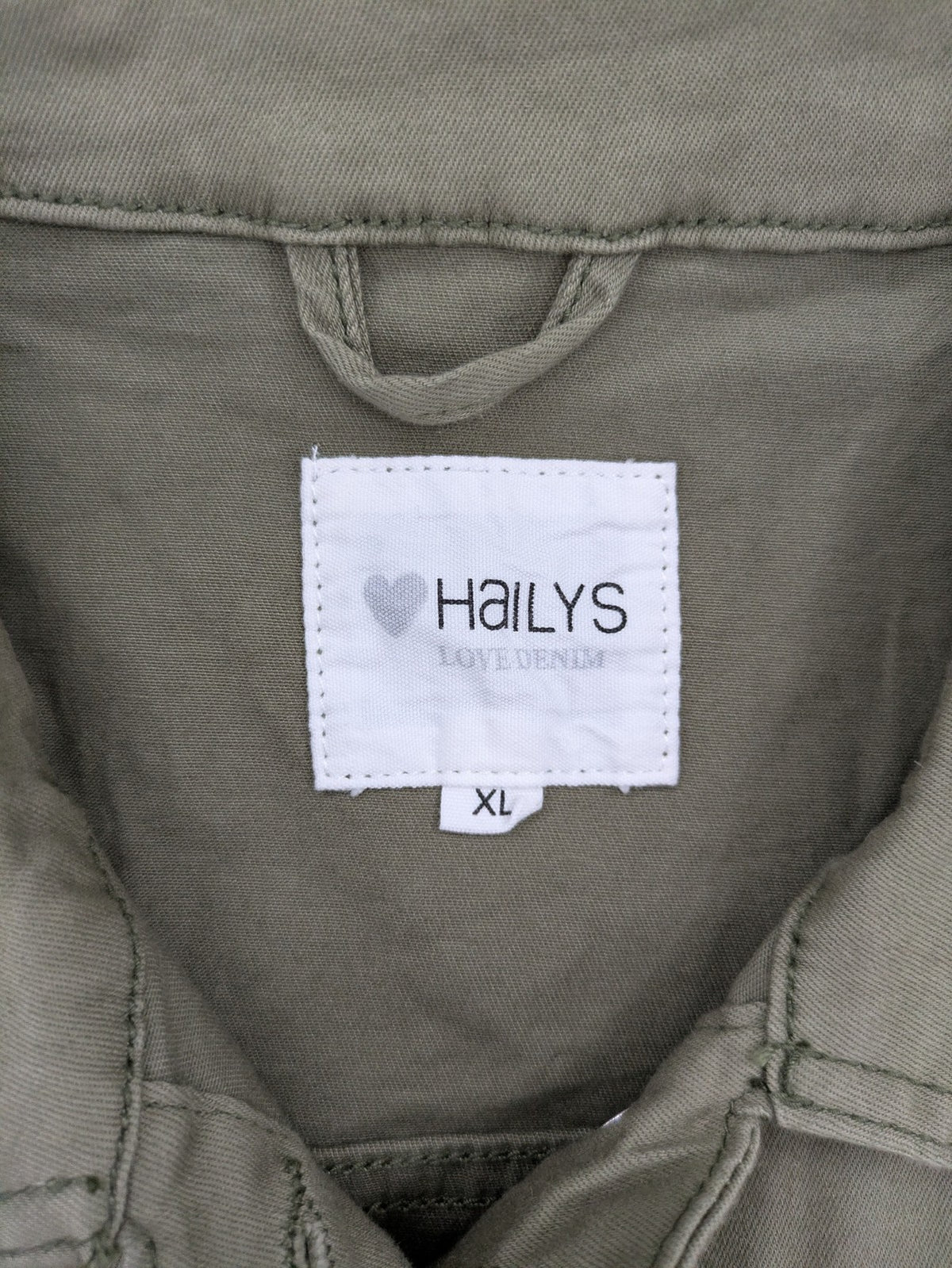 Hailys khaki denim jacket with button closure, two chest pockets, and side pockets.