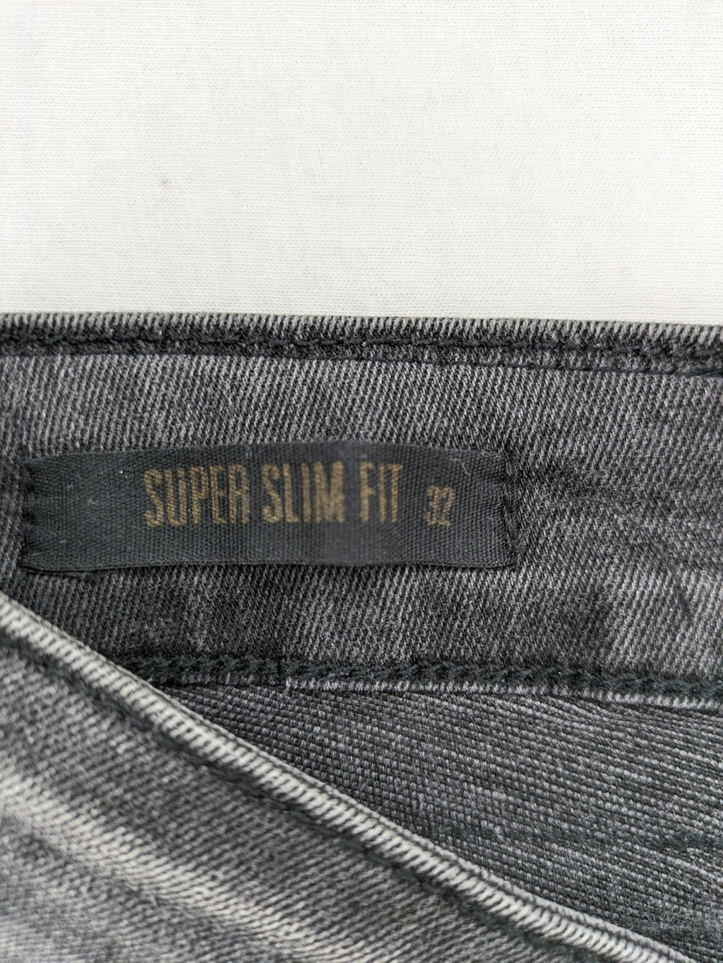 Elias Rumelis grey super slim fit jeans with stitched logo and subtle used look.