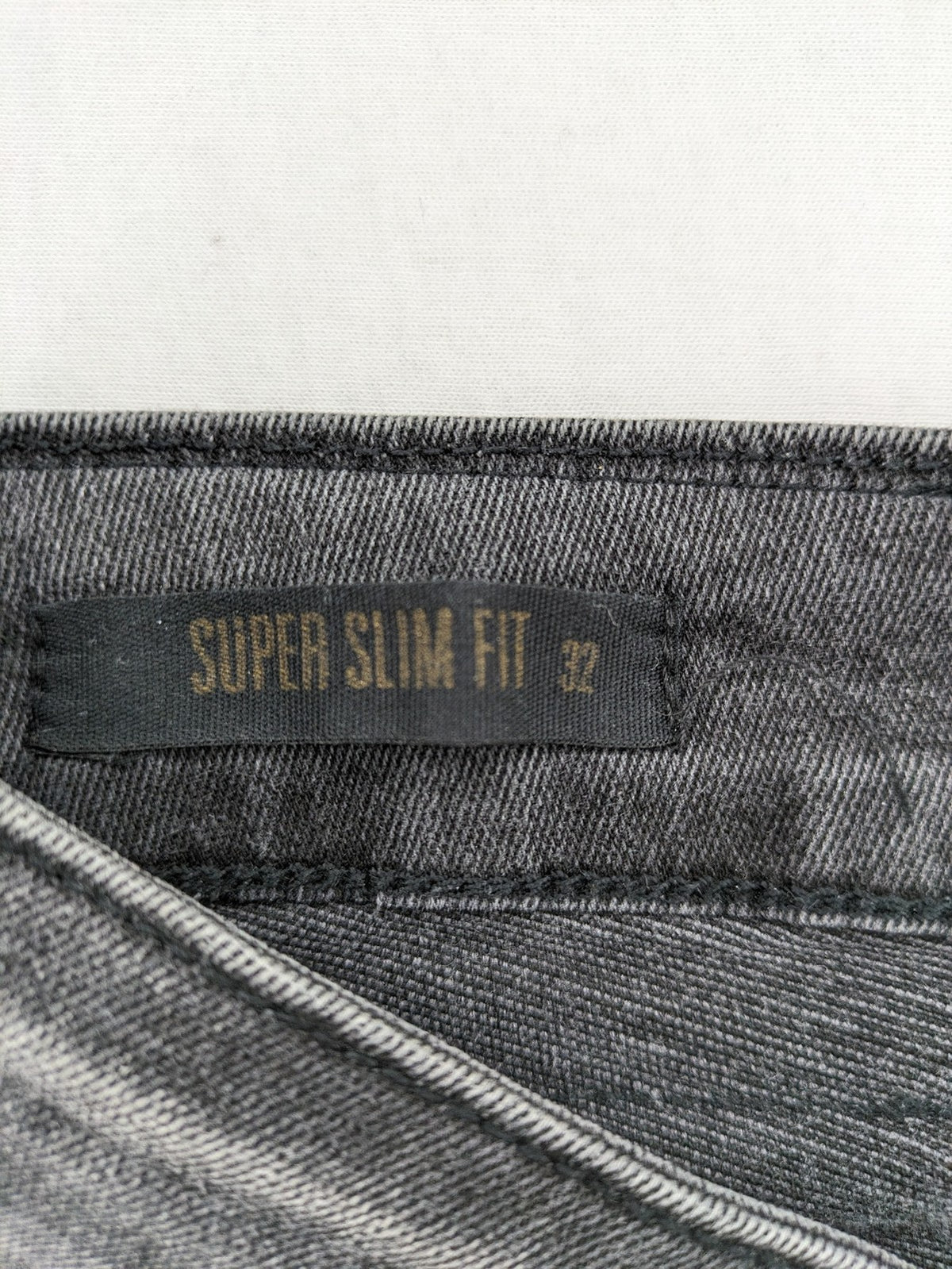 Elias Rumelis grey super slim fit jeans with stitched logo and subtle used look.