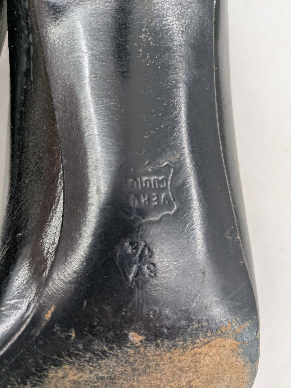 Bruno Magli black high heels leather with grey bow detail and classic silhouette.