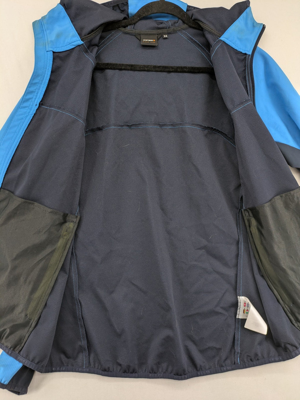 Icepeak blue softshell jacket colorblock design with zip pockets and logo details.