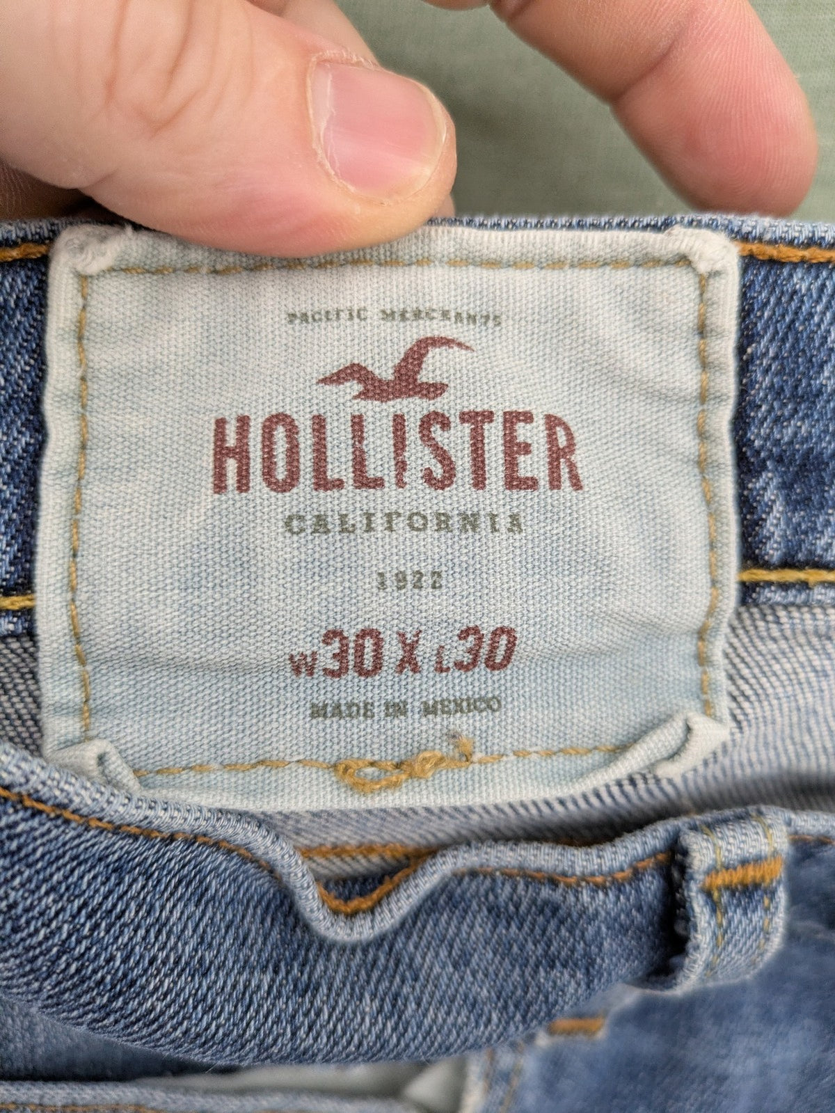 Hollister blue slim fit jeans with classic 5-pocket design and stretch denim material.